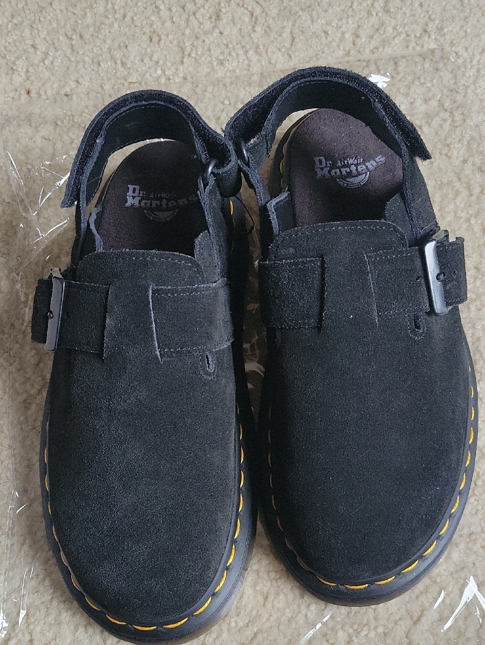 Dr. . Martens Jorge II black suede slingback mules featuring signature yellow